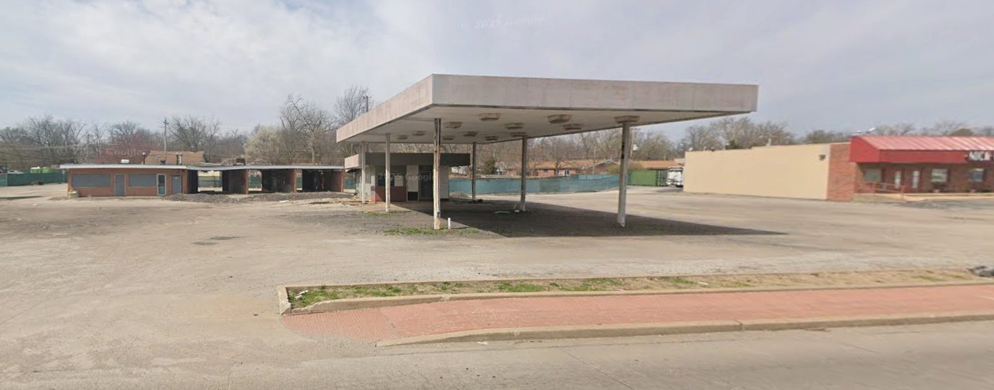 Abandoned gas station / lot at 2929 Woodson Rd